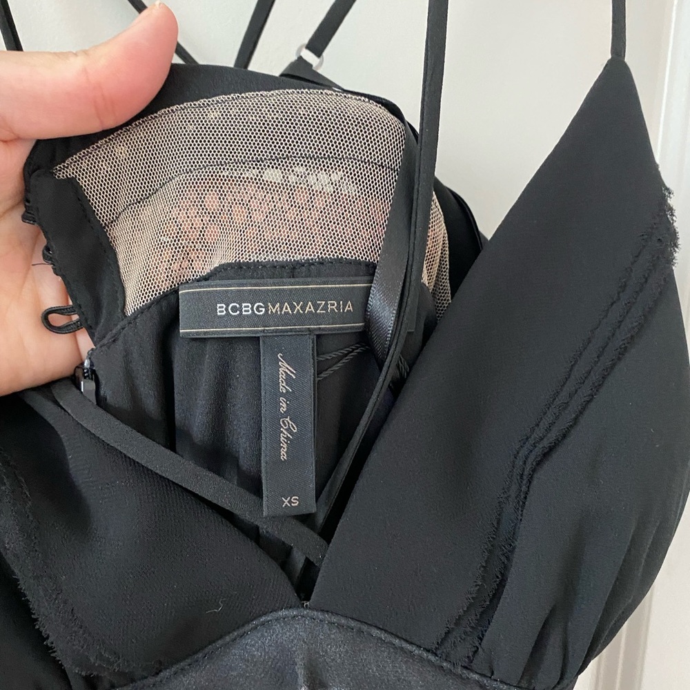 BCBG black dresswith criss cross straps on the back. Size xs